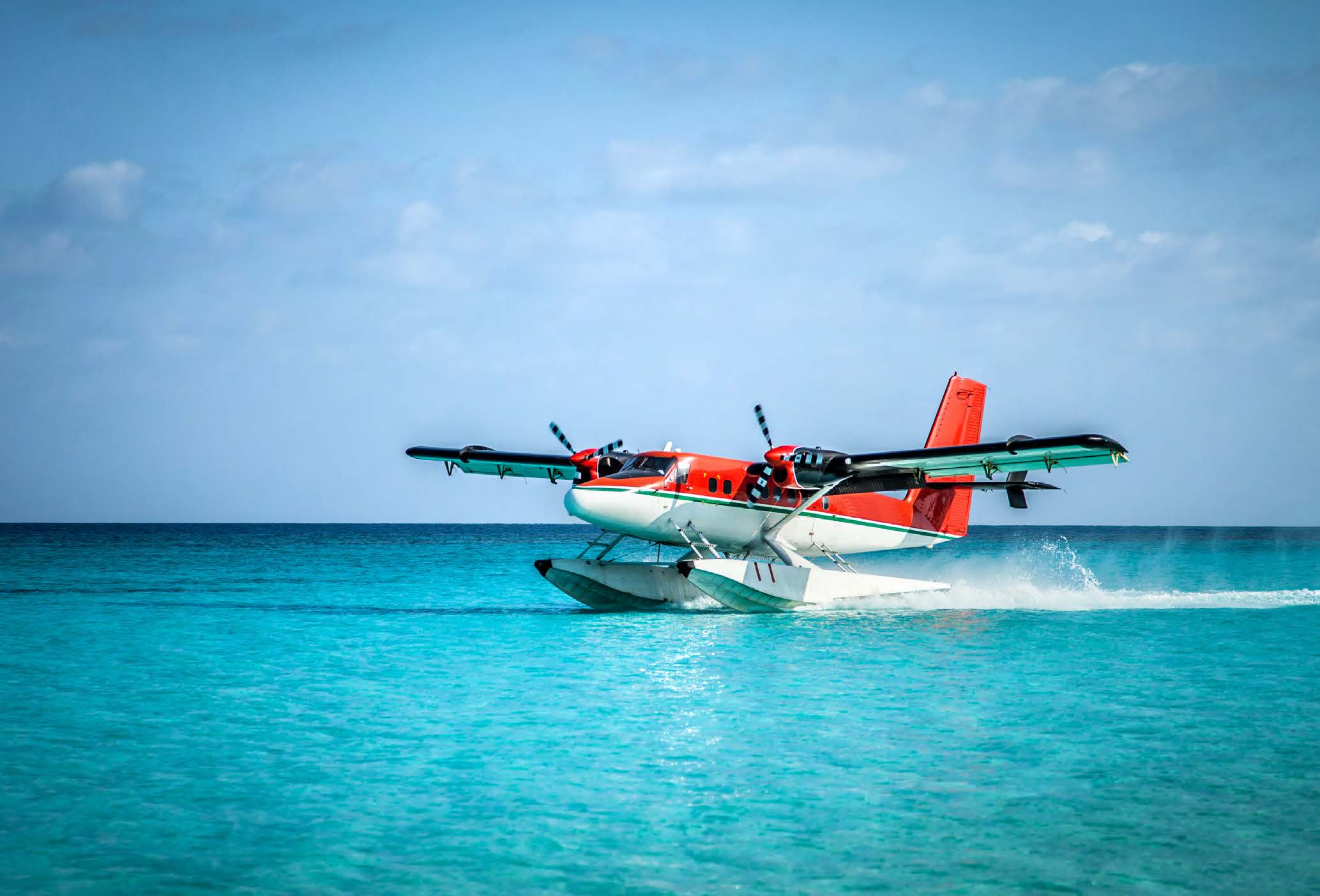 Seaplane landing in the ocean lagoon