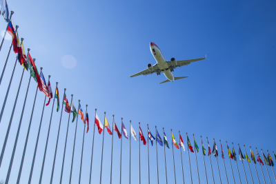 countries Flags and plane: cooperation in the aviation sector